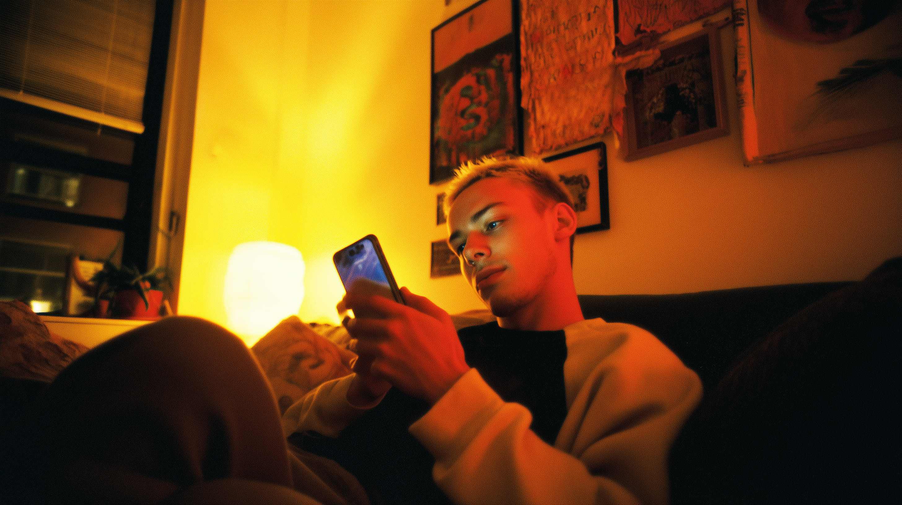 Person scrolling phone alone at home